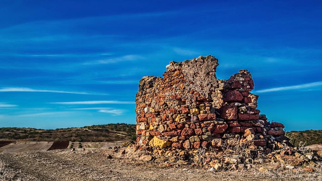 Ancient city ruins with vibrant sunset